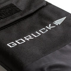 Close-up of a black fabric bag with white "GORUCK" embroidery and arrow logo, designed to pair with the RPC Long + 30LB (Long) Plate Bundle for your Ruck Plate Carrier or weight vest.