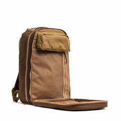 The Double Bullet Ruck w/ Bombproof Laptop Compartment - 18L stands upright in brown and tan, its front compartment unzipped to reveal mesh pockets and a secure laptop section.