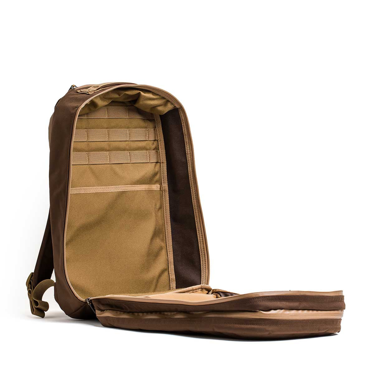 The Double Bullet Ruck w/ Bombproof Laptop Compartment - 18L features two compartments, interior pockets, storage slots, and a secure laptop sleeve—making it a tough, reliable travel backpack.