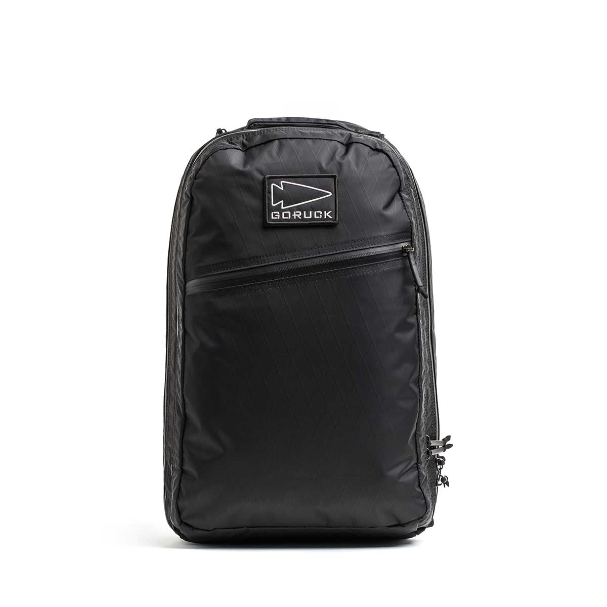 The Double Compartment Bullet Ruck - XPAC is a black GORUCK travel backpack featuring a diagonal zipper pocket, double compartment ruck design, and logo patch, shown on a plain white background.