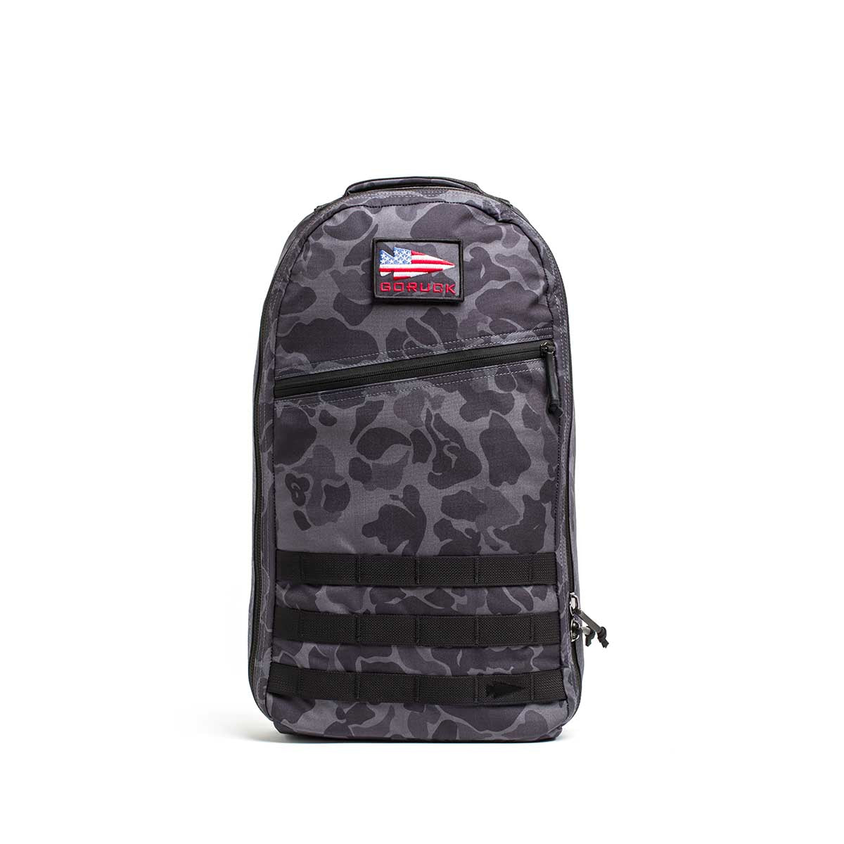 The Double Compartment Bullet Ruck - Ballistic Nylon Cordura - 18L features a gray camo pattern, Puerto Rican flag patch, front zipper pockets, and a bombproof laptop compartment, shown on a white background.