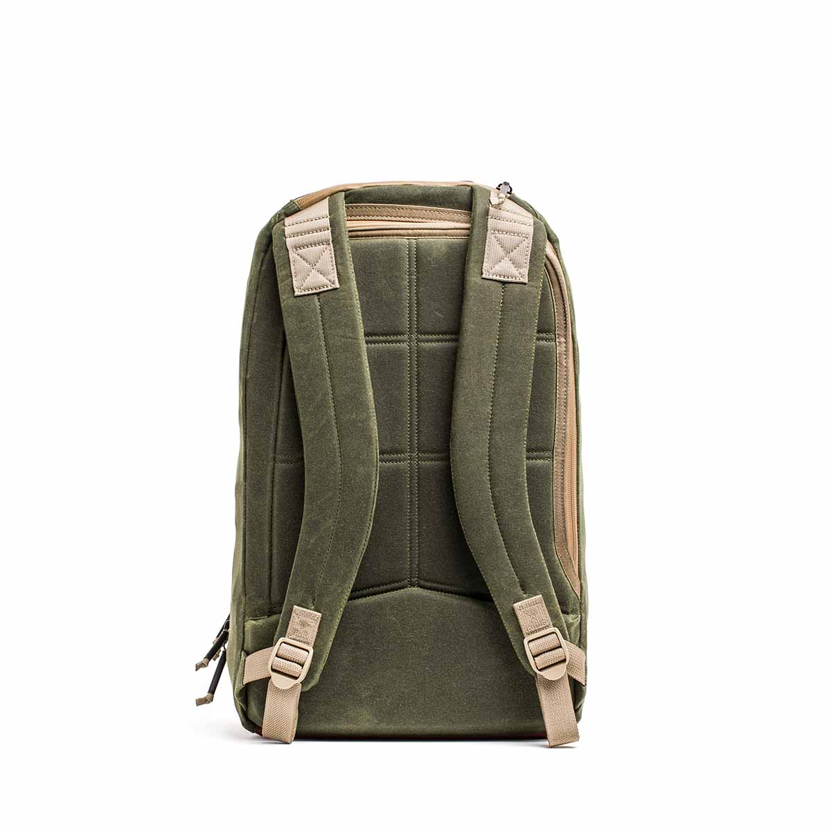 The Waxed Canvas 18L Bullet Ruck, shown from the back, features padded straps and a top handle. This durable backpack has dual compartments and includes the Scars Lifetime Guarantee for peace of mind.