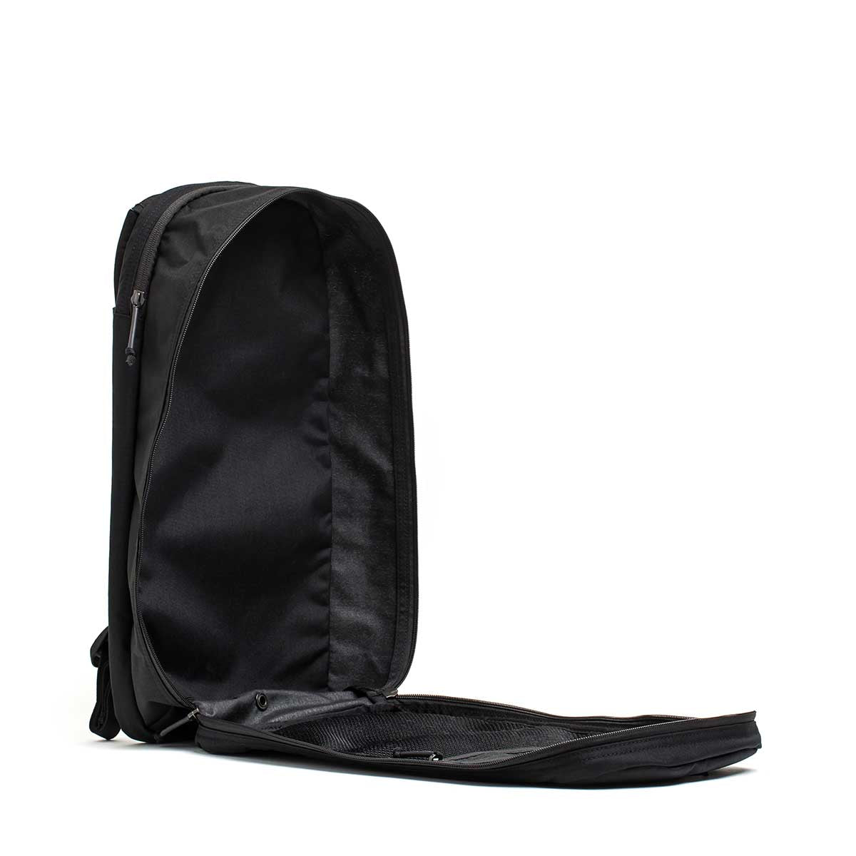 The Bullet Ruck USA Throwback daypack stands upright with its main compartment unzipped, showing off its durable CORDURA construction, displayed against a white background.