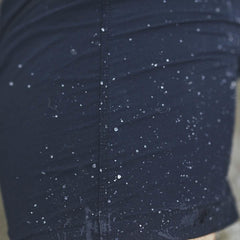 Close-up of water droplets on dark navy GORUCK Challenge shorts fabric