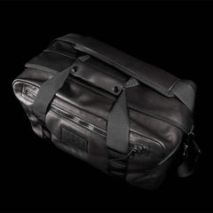 GORUCK black kit bag with rugged handles and zipper, shown on black background