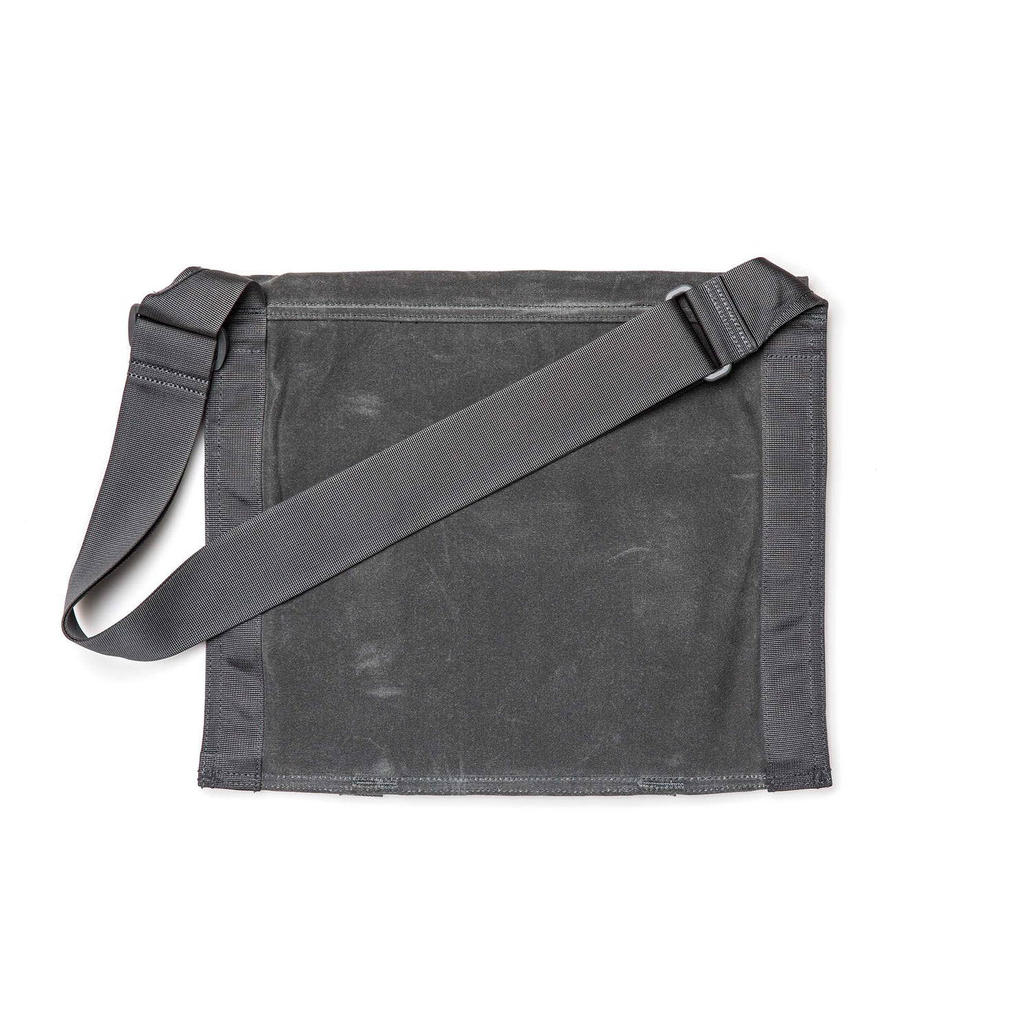 The Waxed Canvas Claymore Sling Bag is a flat, dark gray bag with an adjustable strap, displayed against a white background.
