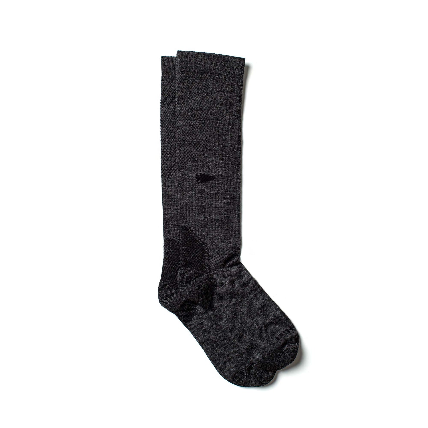 A pair of Merino Compression Socks in dark gray, featuring a long design and graduated compression, is displayed flat on a white background.