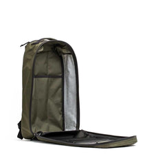 Open dark green 15L Bullet rucksack with stash pocket by GORUCK, showing interior organization and durable fabric