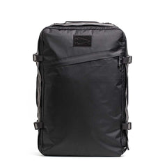 The GR3 - X-PAC is a sleek black carry-on backpack featuring a front diagonal zipper, side compression straps, and waterproof construction that stands upright.