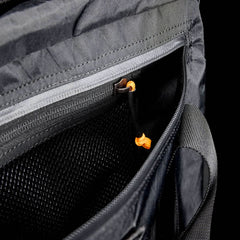 Close-up of the Kit Bag - X-PAC, open to reveal a zippered pocket with orange cord pull, mesh lining, and durable X-PAC VX21 fabric inspired by Special Forces gear.