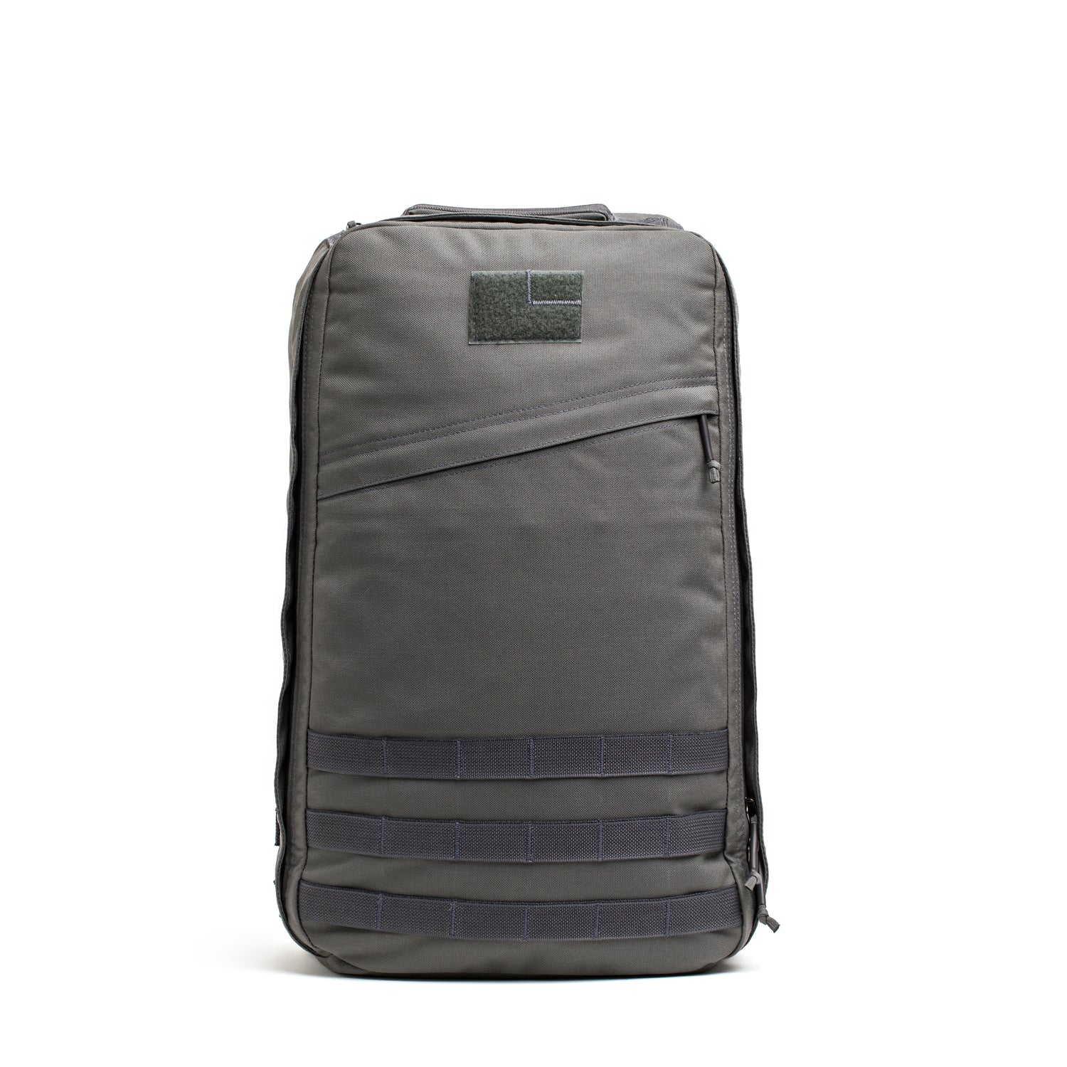 The GR1 USA - Cordura rucksack, shown upright on a white background, features a front zipper pocket and horizontal webbing straps, inspired by Special Forces design.