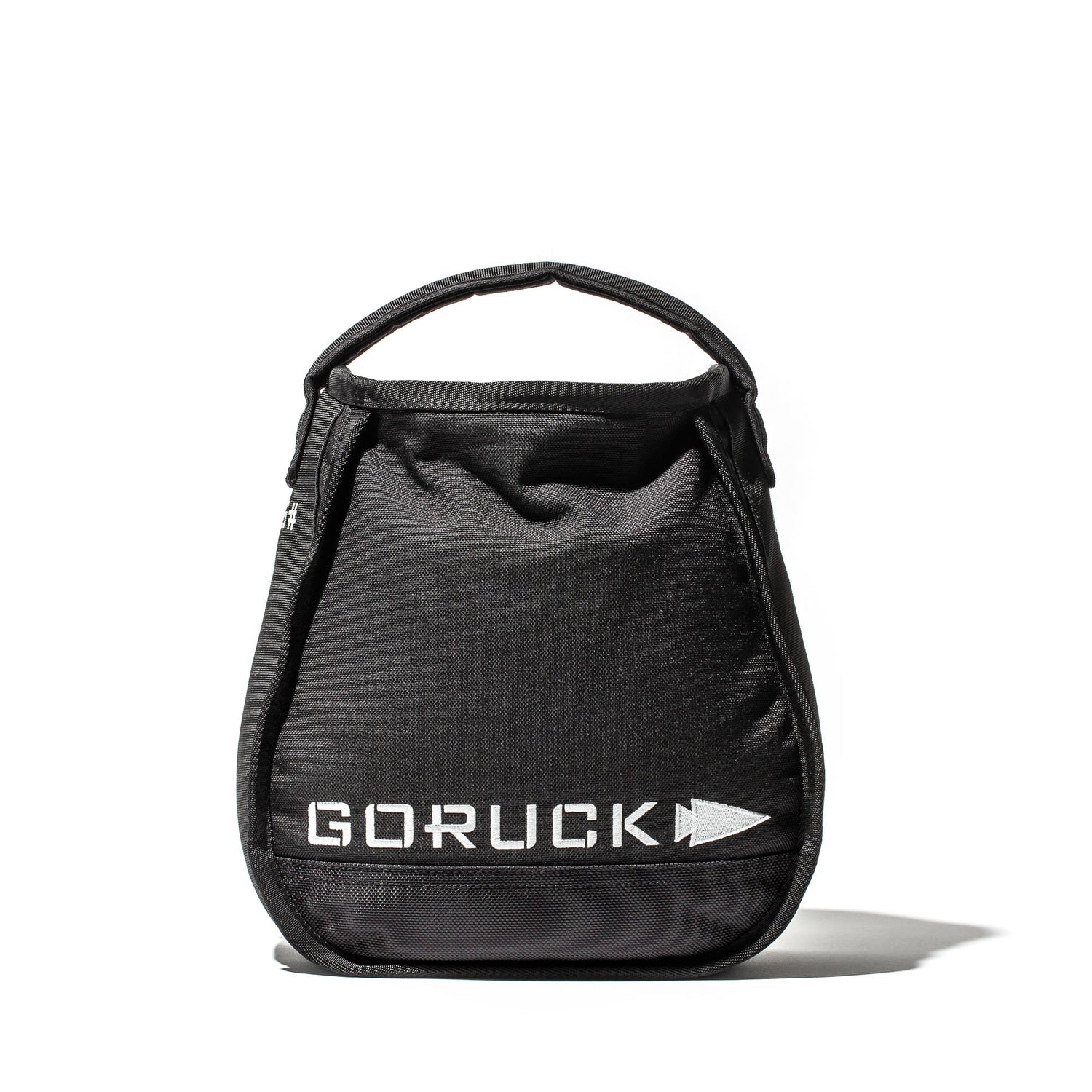 The black Sand Kettlebells by GORUCK, shown with a handle on a white background, are ideal as portable kettlebells for at-home training.