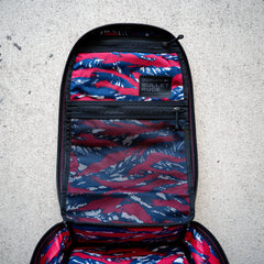 Open the Bullet Ruck Classic - Ballistic Nylon Cordura backpack, featuring a red, white, and blue camo interior with mesh pockets.