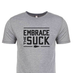 A tri-blend gray T-shirt from vendor-unknown featuring bold black text that reads "EMBRACE THE SUCK" with an arrow pointing right, capturing the USMC's spirit and resilience.