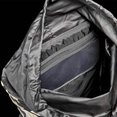 The GORUCK M24 - Cordura rucksack effortlessly reveals its interior, showcasing a black exterior and roomy compartments. The smooth lining is paired with a mesh zippered pocket, while additional storage sections emphasize its use of durable materials for everyday reliability.