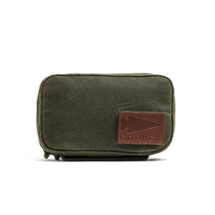 The GR1 Field Pocket - Waxed Canvas in olive green features a brown Red Wing leather GORUCK patch on the front, displayed against a white background.