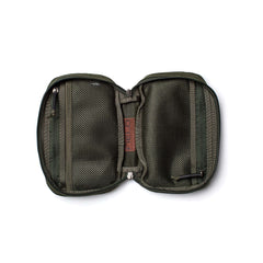 The GR1 Field Pocket - Waxed Canvas is shown open from above on a white background, featuring green waxed canvas, mesh pockets, and a pen.