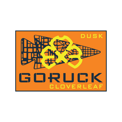 Orange rectangle with yellow gears, black arrows, and text: "24 Hour Cloverleaf - Jax Beach Edition"—a rucking endurance event inspired by Jacksonville Beach.