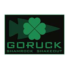 GORUCK Shamrock Shakedout logo with green clover and arrowhead on black background
