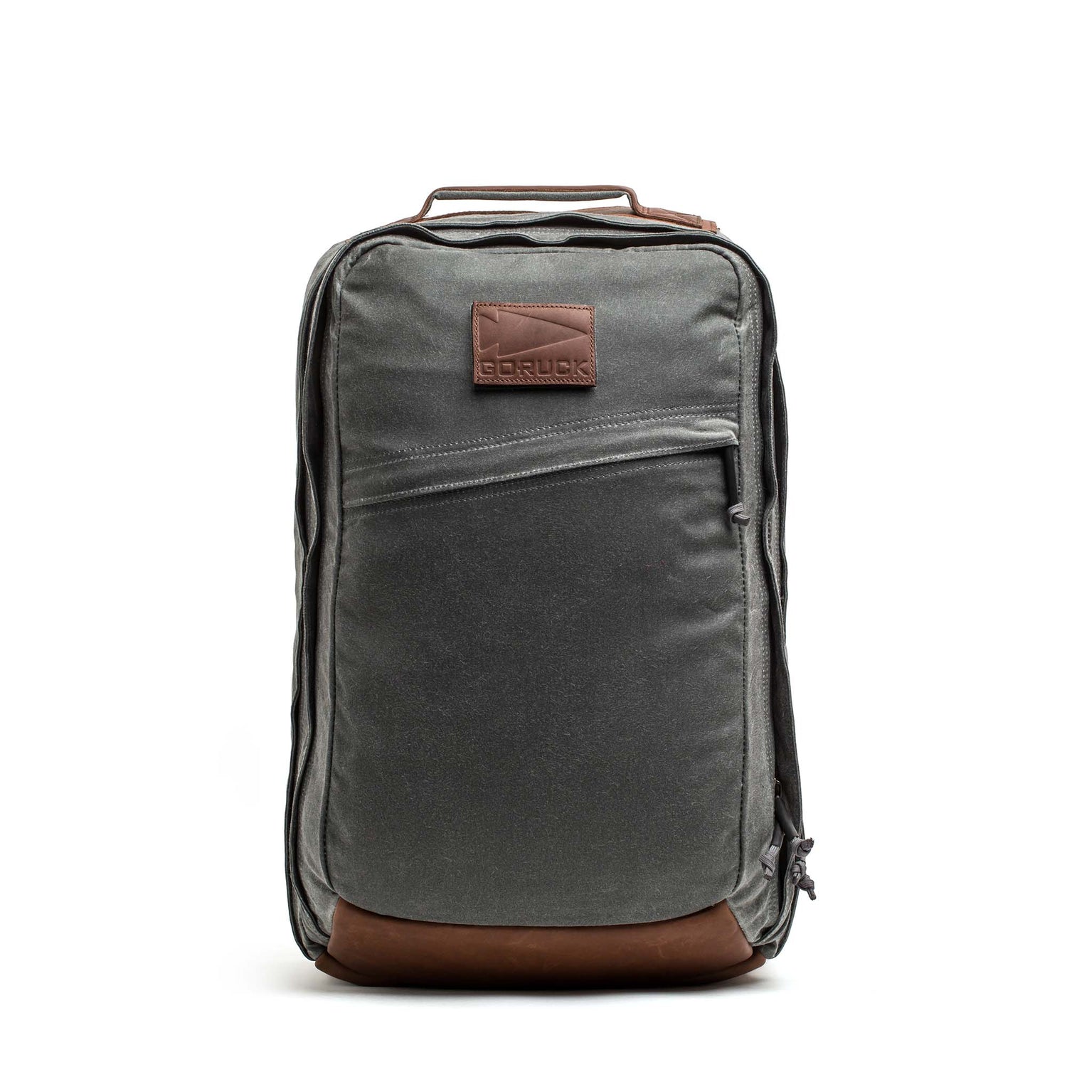 The GR2 - Heritage Waxed Canvas backpack features gray and brown waxed canvas, Red Wing Leather accents, and a front zipper pocket—perfect for travel and adventure.