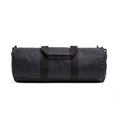 The Gym Bag - Waxed Canvas features short handles and a shoulder strap, shown against a white background.