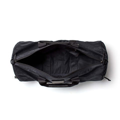 Black Gym Bag - Waxed Canvas, 38L, shown from above with open zipper revealing empty interior on a white background.