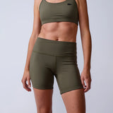 GORUCK women's olive green rucking shorts and sports bra studio photo