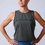 Woman wearing a gray GORUCK muscle tank top, athletic rucking gear, studio background