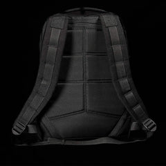 Back view of a black GORUCK tactical rucksack with padded shoulder straps and ergonomic back panel