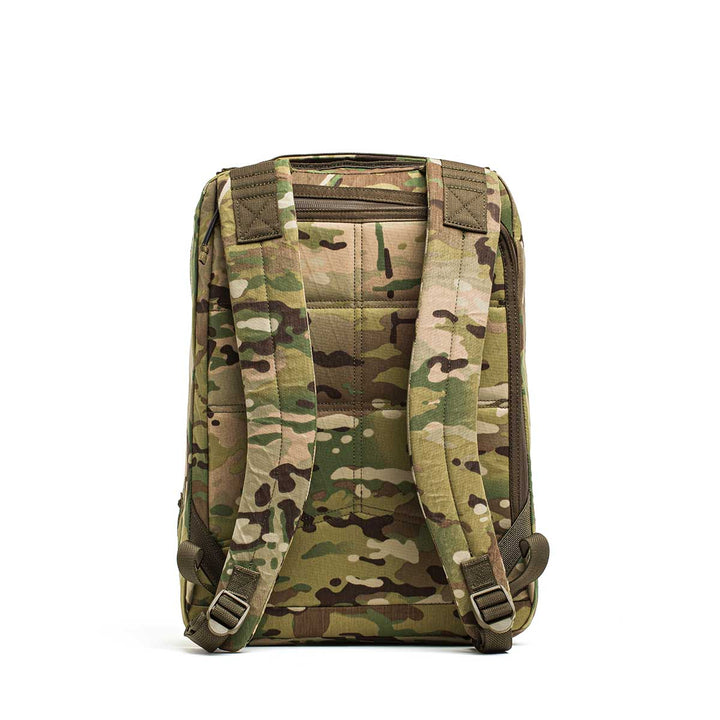 The GR0 - X-PAC is a lightweight, waterproof camouflage rucksack with padded shoulder straps, pictured from the back on a white background.