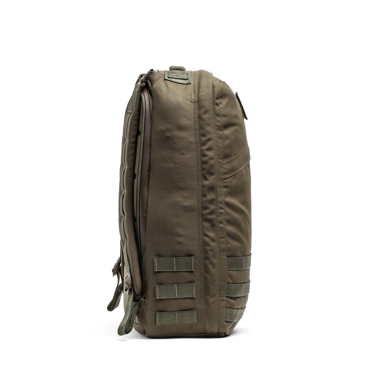 Side view of the GR1 USA - Cordura in olive green, a Special Forces grade tactical backpack with straps and MOLLE webbing for everyday carry, shown on a white background.