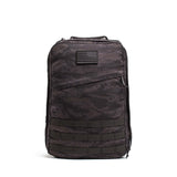 The GR1 USA – Cordura is a black camo everyday rucksack with an American flag patch and multiple lower front straps, built to Special Forces grade standards.