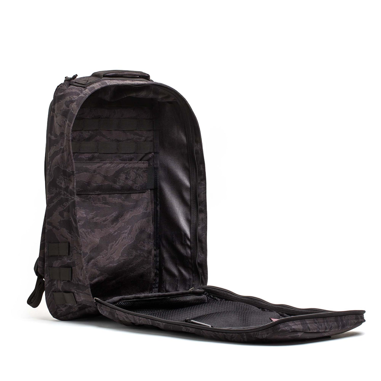 The GR1 USA - Cordura in black camouflage, shown open to display its inner pockets on a white background, is an ideal everyday carry backpack built with Special Forces-grade durability.