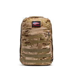 The GR1 USA - Cordura is a camouflage rucksack with a GORUCK patch and American flag patch, built from Special Forces-grade Cordura for the ultimate everyday carry.
