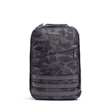 The GR1 rucksack features a black and gray camouflage pattern with a front zipper pocket, shown on a white background. Built to Special Forces grade, it's ideal for everyday carry.