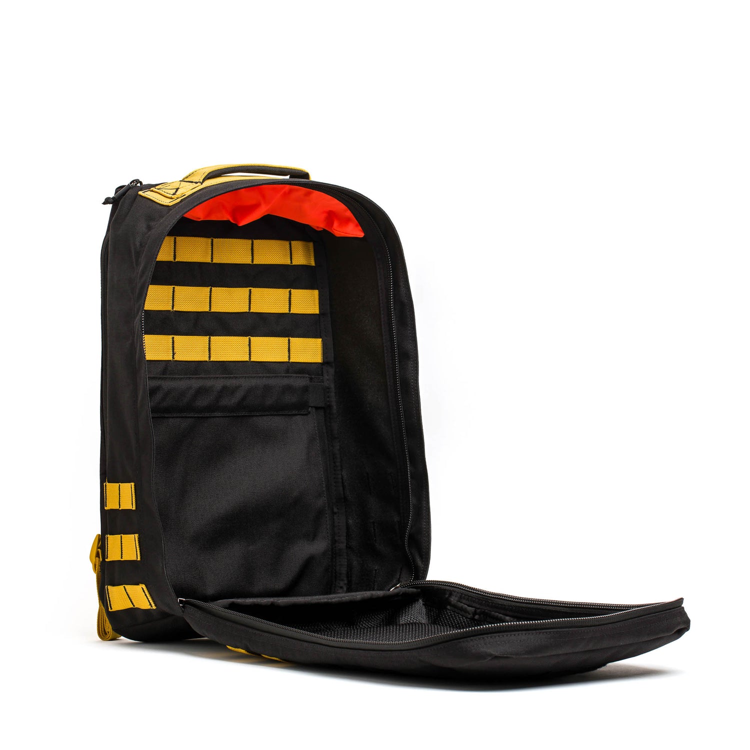 The American-made GR1 backpack features a black exterior, yellow straps, an organized interior with red lining, and is designed for everyday use.