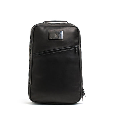 The GR1 USA x Carryology - Berserker Viking is a black leather backpack with a top handle and diagonal front zipper pocket, inspired by Vikings, shown on a white background.