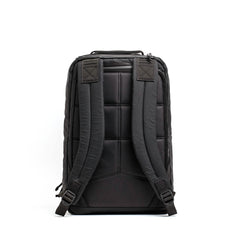 Black GORUCK backpack back view with padded straps and quilted back panel on white background