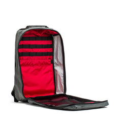 GORUCK GR1 rucksack open showing red interior with mesh and zippered pockets, tactical gear backpack