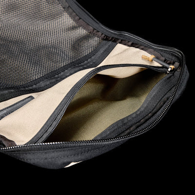 The GR1 Shooter 26L - Built by SCARS is a beige zippered CORDURA® pouch with black mesh and a visible zipper pocket, designed tough for the SCARS team or any Shooter Ruck, shown against a black background.