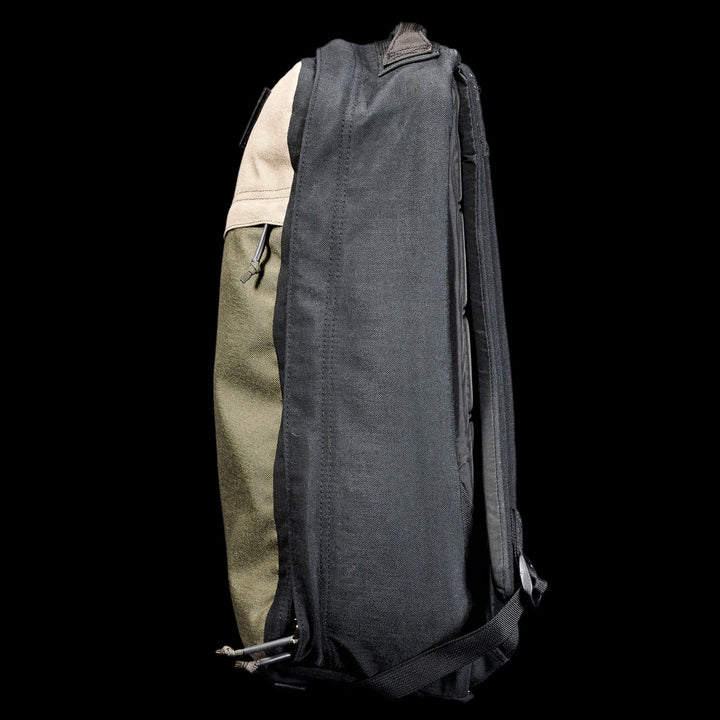 Side view of the GR1 Shooter 26L - Built by SCARS, showing black, green, and tan CORDURA® panels against a black background—engineered for durability by the SCARS team.