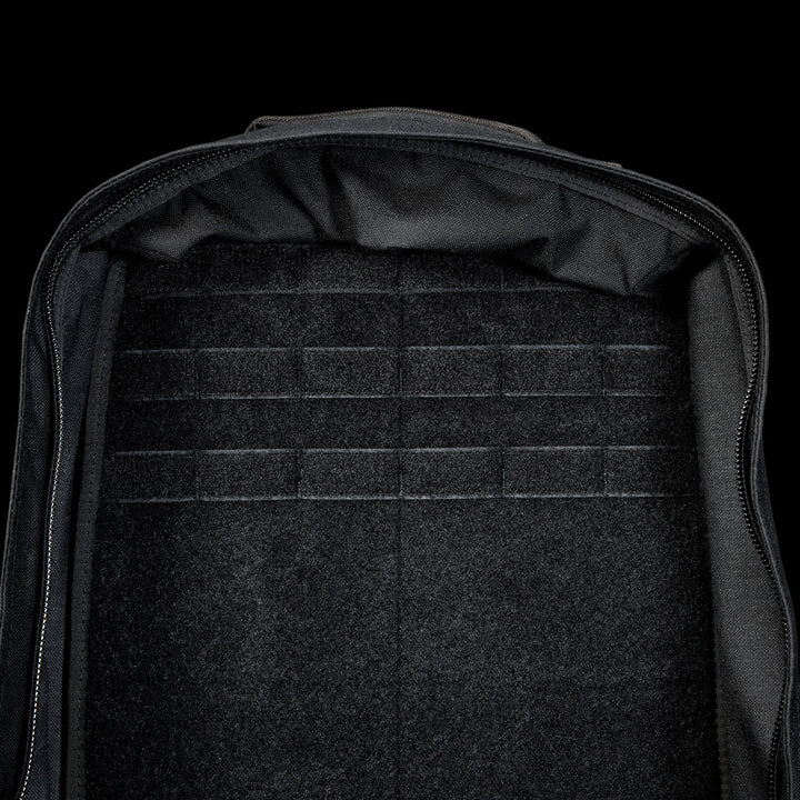 The spacious interior of the black GR1 Shooter 26L - Built by SCARS, made from rugged CORDURA®, has horizontal loop fastener strips—perfect for SCARS team needs or organized adventures.
