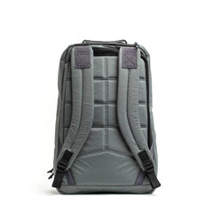Back view of charcoal gray rugged GORUCK rucksack with padded adjustable shoulder straps and quilted back panel