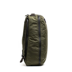 Side view of GORUCK dark green rucksack with durable material and waterproof zipper