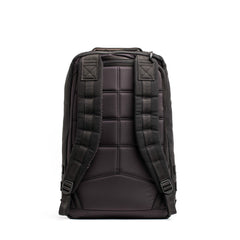 Back view of black GORUCK padded rucksack with adjustable shoulder straps on white background