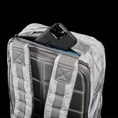 Close-up of GORUCK Arctic Camo 26L rucksack with padded straps and phone in back zipper pocket