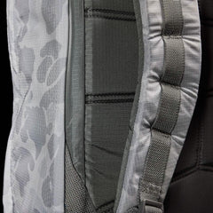 Close-up of gray Arctic Camo GORUCK backpack strap with durable stitched webbing and padded back