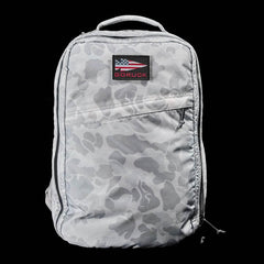 GORUCK Arctic camo backpack with American flag patch on front pocket against black background