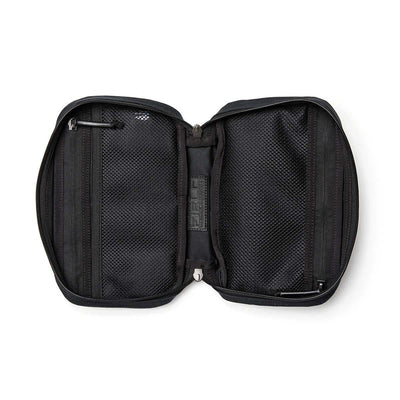 The GR1 Field Pocket - Waxed Canvas travel pouch is shown unzipped, revealing two mesh compartments and small interior pockets.