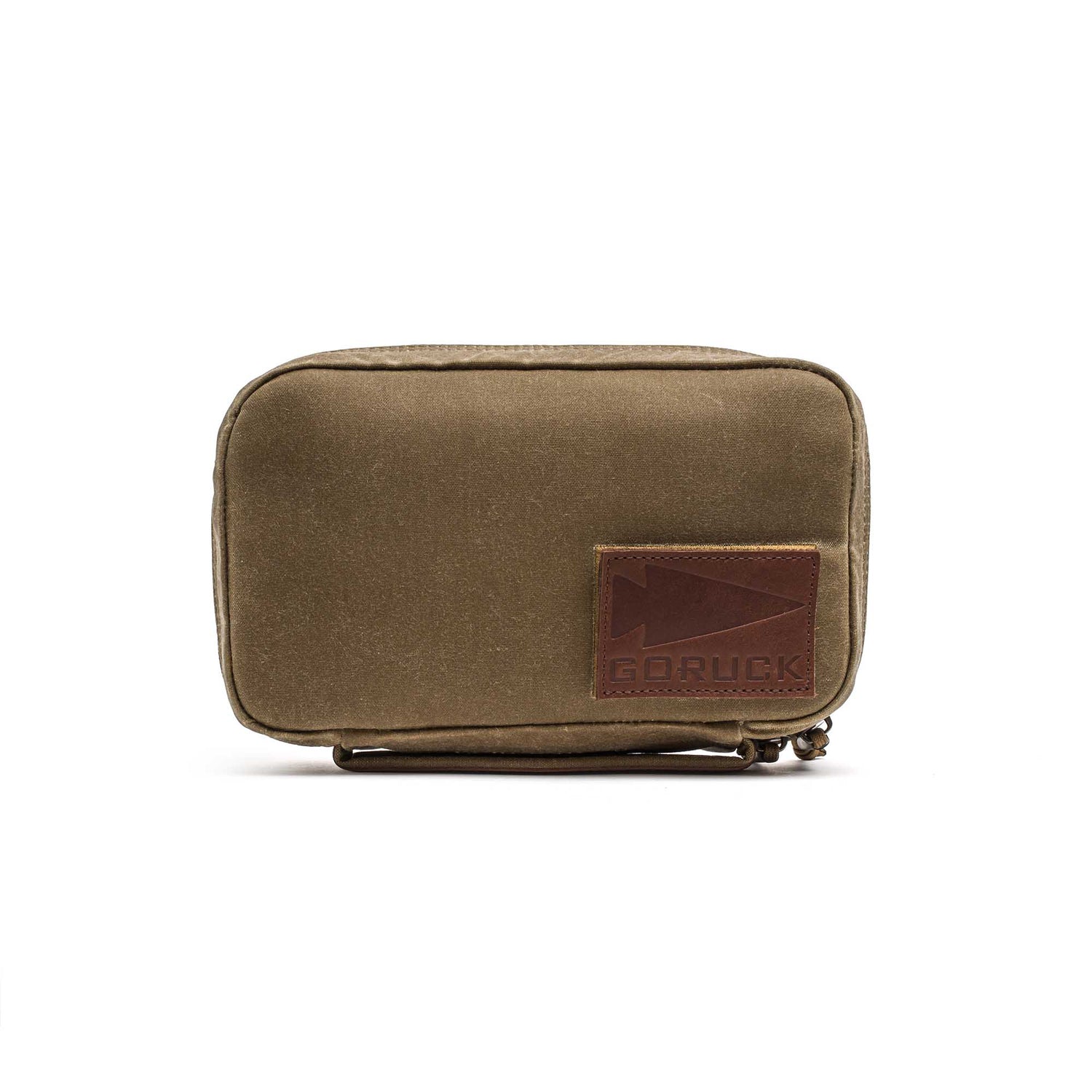 The GR1 Field Pocket - Waxed Canvas in small olive green features a front brown leather GORUCK patch made from Red Wing Leather, shown on a white background.